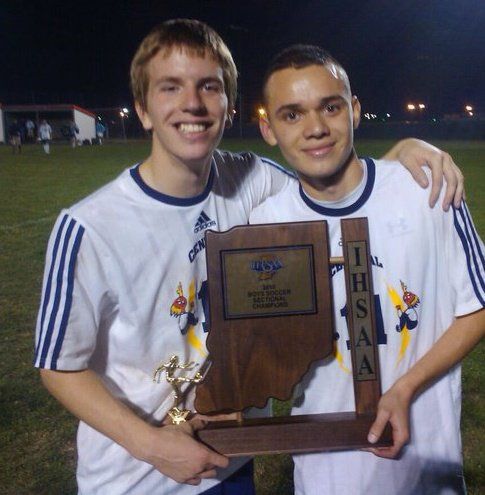 Mario with Justin holding soccer tropy